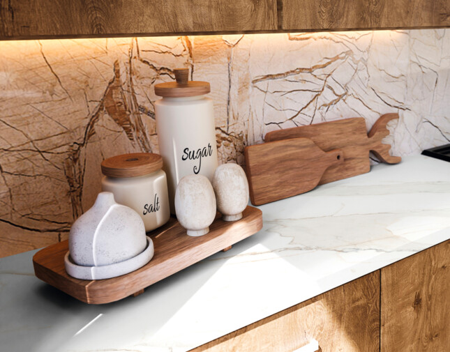 Moderne Küche mit Holzschränken, Gewürzbehältern und Gaskochfeld. Beleuchtung unter den Schränken hebt die Arbeitsplatte hervor.