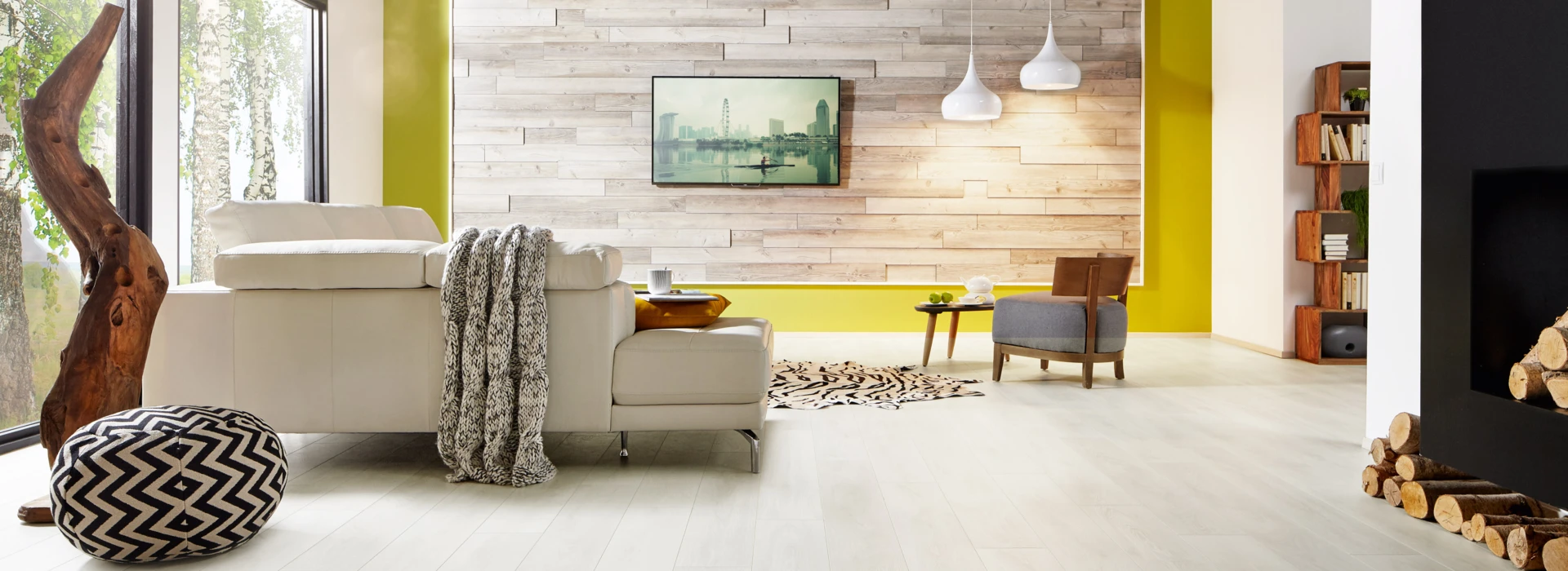 Living room with laminate flooring, white sofa, and wooden accents.
