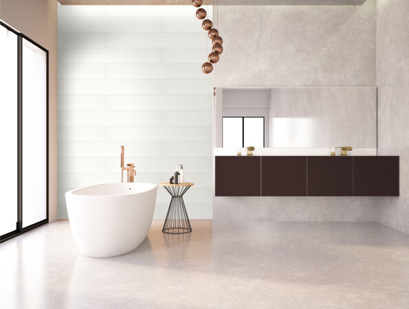 Minimalist bathroom with a freestanding tub, large mirror, and elegant fixtures. Laminate flooring adds a sleek touch.